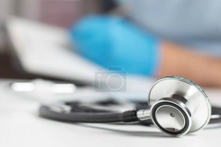 Stethoscope on background doctor and pacient blank in clinic.-stock-photo
