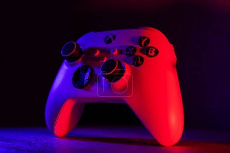Photo for Xbox Series S game controller on dark. Red and blue light - 29 september, 2023 - Dnipro, Ukraine. - Royalty Free Image