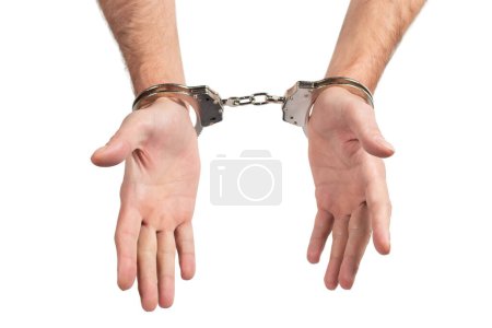 Photo for Man's hands in handcuffs on a white background, isolated. - Royalty Free Image