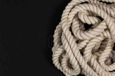 Photo for Rope detail on dark. Close-up of its rope texture Depth of field minimalism ropes. - Royalty Free Image