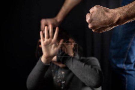 Domestic violence man against child clenched fist.