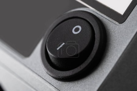 Black On off button close up.