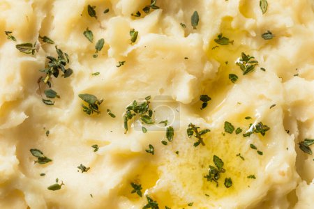 Photo for Homemade Thanksgiving Mashed Potatoes with Butter and Thyme - Royalty Free Image