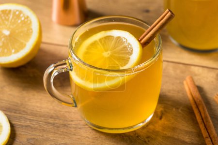 Photo for Boozy Warm Holiday Hot Toddy Cocktail with Rum and Lemon - Royalty Free Image