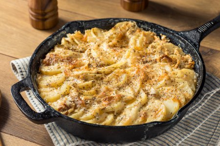 Photo for Homemade Cheesy Potatoes Gratin in a Pan - Royalty Free Image