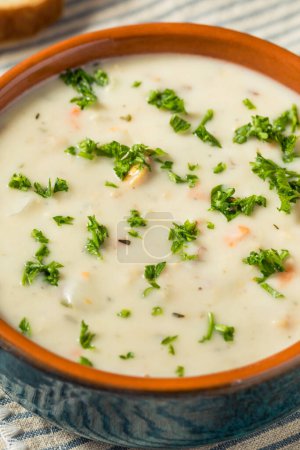 Photo for Homemade Creamy Clam Chowder Soup with Bread and Parsley - Royalty Free Image
