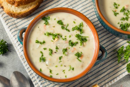 Photo for Homemade Creamy Clam Chowder Soup with Bread and Parsley - Royalty Free Image
