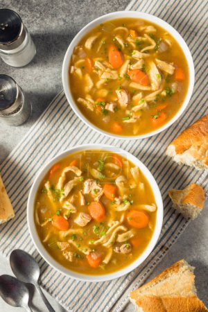 Photo for Homemade Chicken Noodle Soup with Carrots and Celery - Royalty Free Image