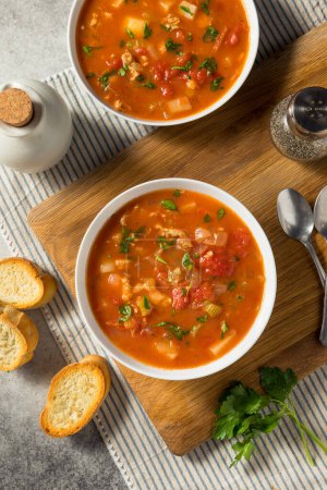Photo for Homemade Manhattan Clam Chowder with Tomato and Parsley - Royalty Free Image