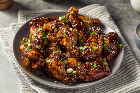 Photo for Homemade Asian Chili Crunch Chicken Wings with Sesame Seeds - Royalty Free Image