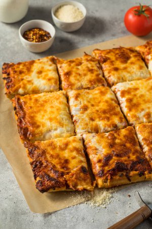 Photo for Homemade Grandma Cheese Pizza Pie with Tomato Sauce - Royalty Free Image