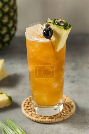 Photo for Boozy Refreshing Rum Bahama Mama Cocktail with Pineapple and Coconut - Royalty Free Image