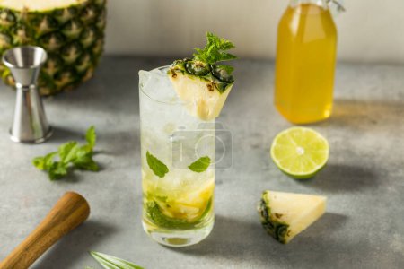 Photo for Boozy Refreshing Pineapple Mojito Cocktail with Rum and Lime - Royalty Free Image