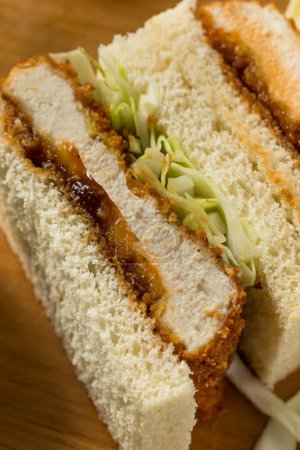 Foto de Homemade Japanese Chicken Katsu Sando Sandwich with Tonkatsu Sauce - Imagen libre de derechos