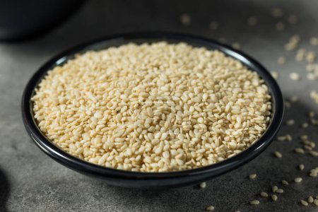 Téléchargez les photos : Homemade Organic White Sesame Seeds in a Bowl - en image libre de droit