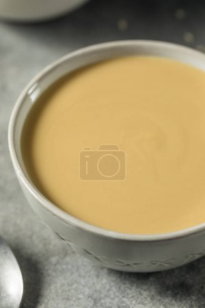 Foto de Homemade Organic Tahini Sesame Paste in a Bowl - Imagen libre de derechos