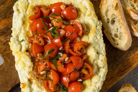 Photo for Homemade Creamy Baked Goat Cheese Dip with Tomatoes and Bread - Royalty Free Image