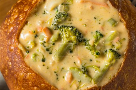 Foto de Homemade Broccoli Cheddar Soup Bread Bowl with Parsley - Imagen libre de derechos
