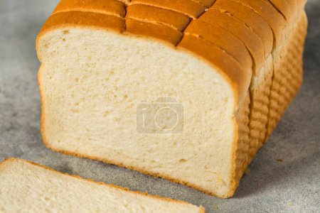 Téléchargez les photos : Organic Whole Wheat White Bread Cut into Slices - en image libre de droit