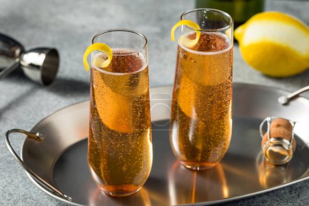 Foto de Boozy Refreshing French Kir Royale Champagne Cocktail with Lemon and Cassis - Imagen libre de derechos