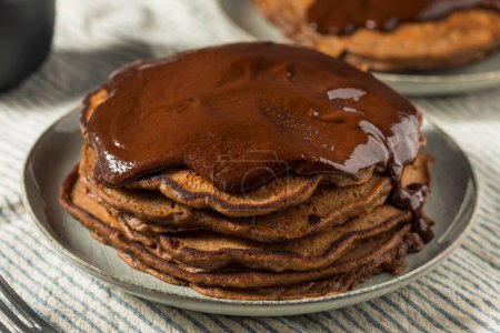Photo for Gourmet Homemade Chocolate Pancakes With Ganache Sauce - Royalty Free Image