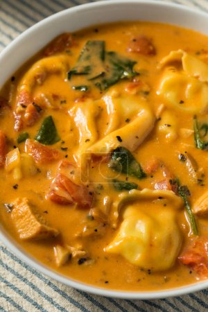 Photo for Homemade Creamy Tortellini The Soup with Chicken and Tomato - Royalty Free Image