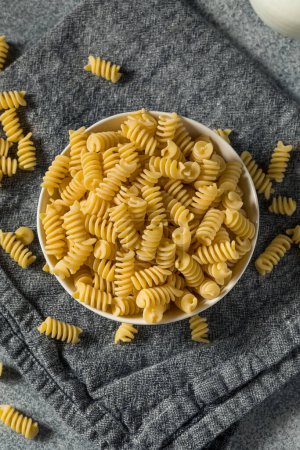 Photo for Raw Dry Organic Fusilli Pasta in a Bowl - Royalty Free Image