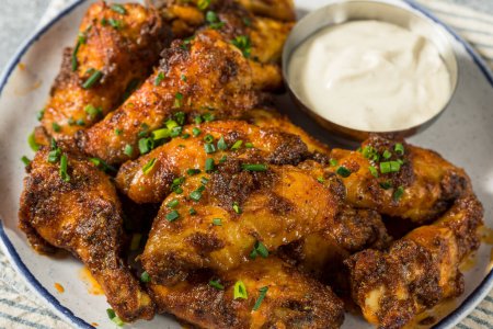 Photo for Homemade Nashville Hot Chicken Wings with Ranch Dressing - Royalty Free Image
