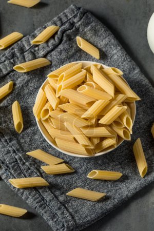 Photo for Raw Organic Pennoni Pasta in a Bowl - Royalty Free Image