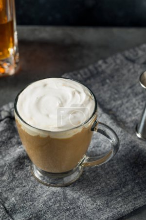 Foto de Boozy Refreshing Irish Coffee Cocktail with Whipped Cream - Imagen libre de derechos