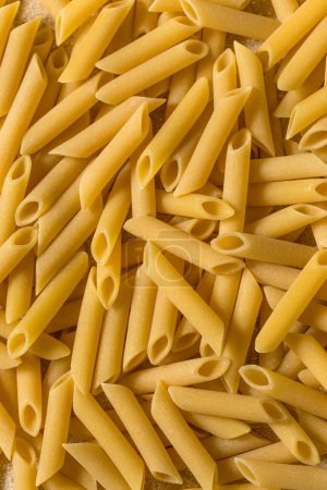 Photo for Raw Dry Mostaccioli Penne Lisce Pasta in a Bowl - Royalty Free Image
