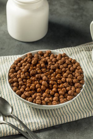 Photo for Healthy Sweet Chocolate Puff Cereal with Milk - Royalty Free Image
