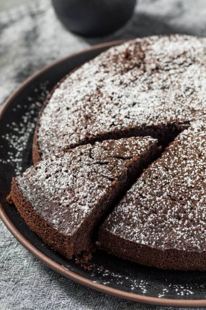 Photo for Baked Chocolate Olive Oil Cake with Powdered Sugar - Royalty Free Image