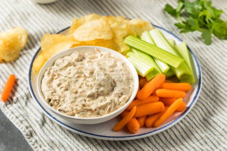 Photo for Homemade Healthy Carmelized Onion Dip with Chips and Celery - Royalty Free Image