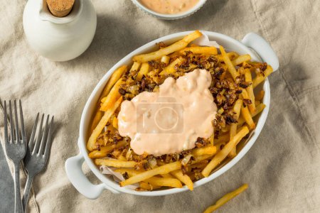 Photo for Homemade Animal Loaded French Fries with Onions and Burger Sauce - Royalty Free Image