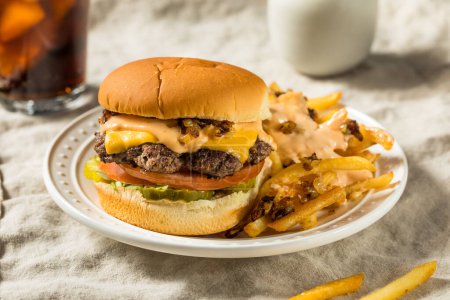 Photo for Fast Food Animal Cheeseburger with Burger Sauce and Pickles - Royalty Free Image