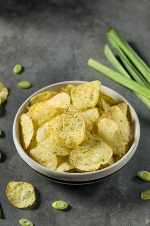 Photo for Crunch Sour Cream and Onion Potato Chips in a Bowl - Royalty Free Image