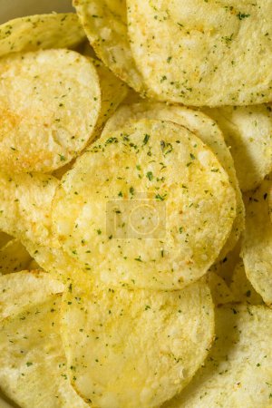 Photo for Crunch Sour Cream and Onion Potato Chips in a Bowl - Royalty Free Image