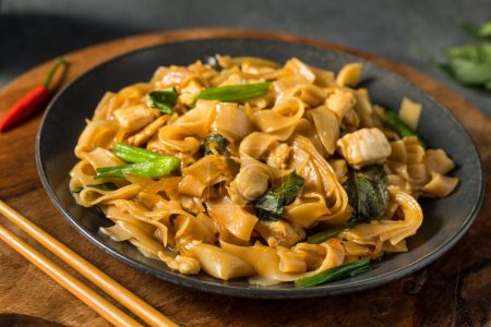 Photo for Spicy Homemade Thai Drunken Noodles with Chicken and Basil - Royalty Free Image