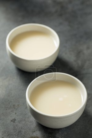 Photo for Boozy Makgeolli Korean Rice Wine in a Bowl - Royalty Free Image