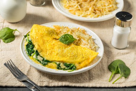 Photo for Homemade Spinach Florentine Omelet with Cheese and Potatoes - Royalty Free Image