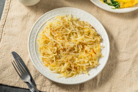Photo for Homemade Breakfast Potato Hash Browns with Salt and Pepper - Royalty Free Image