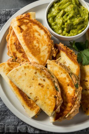 Photo for Homemade Mini Chicken Quesadillas with Salsa and Guac - Royalty Free Image