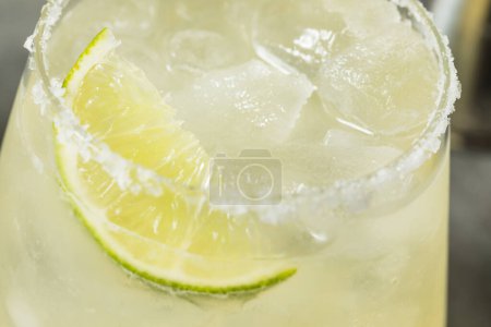 Photo for Boozy Refreshing Mezcal Margarita with Lime and Salt - Royalty Free Image