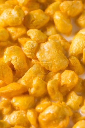 Photo for Sweet Sugar Puffed Corn Cereal for Breakfast in a Bowl - Royalty Free Image