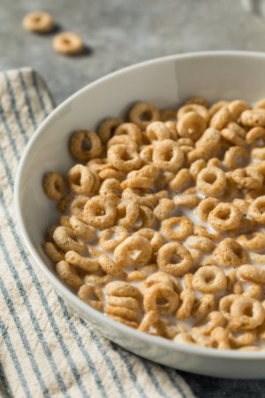 Photo for Healthy Oat Breakfast Cereal Rings with Whole Milk - Royalty Free Image