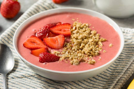 Photo for Homemade Strawberry Smoothie Bowl with Granola and Banana - Royalty Free Image