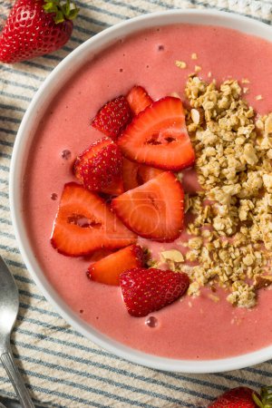 Photo for Homemade Strawberry Smoothie Bowl with Granola and Banana - Royalty Free Image