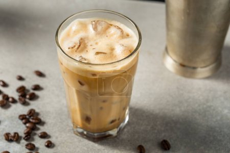 Photo for Cold Shake Oatmilk Latte with Ice in a Glass - Royalty Free Image