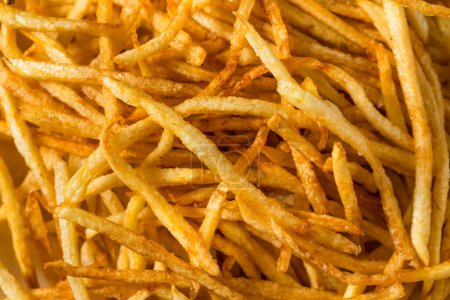 Photo for Homemade Shoesttring French Fries with Salt and Ketchup - Royalty Free Image